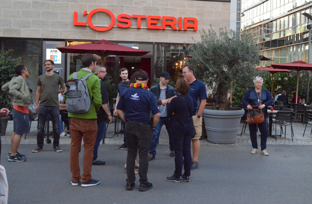 A few members of the group outside of the pizzeria